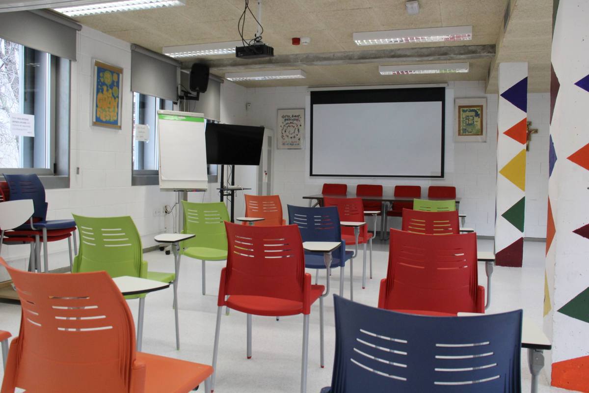 Training classroom with projector and colourful chairs