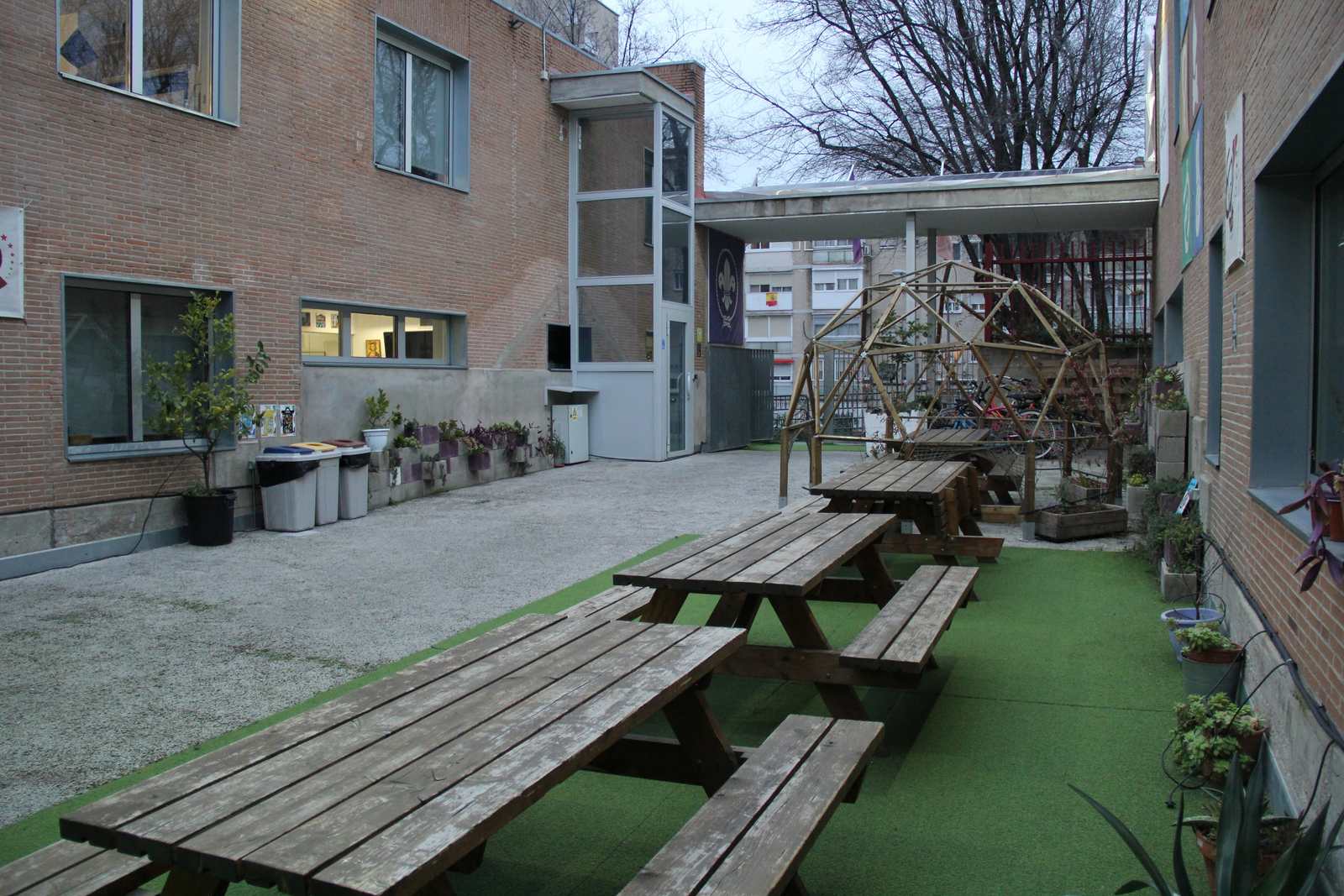 Patio with picnic tables and lawn
